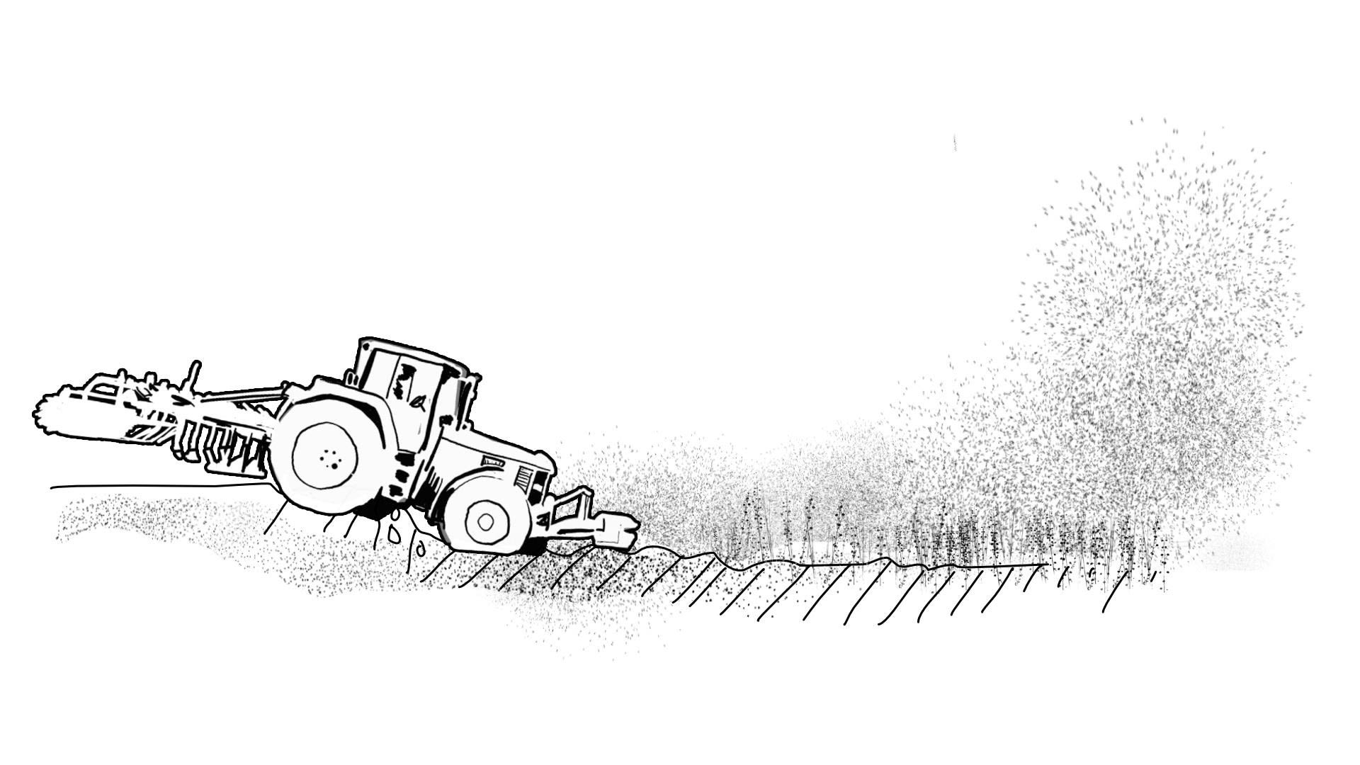 Ein Traktor fährt hinab auf einen Acker